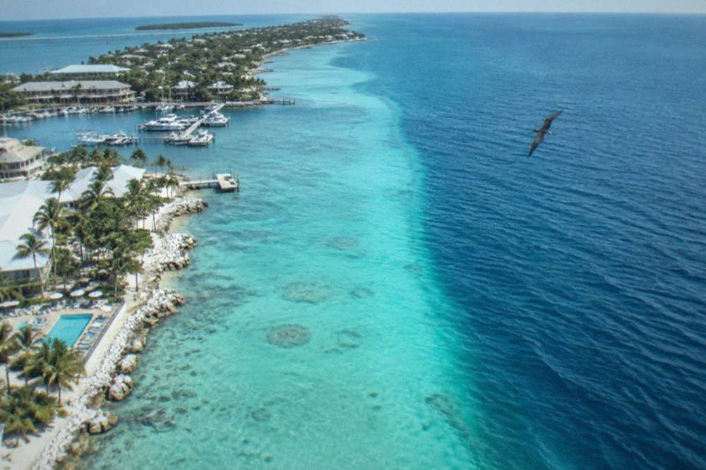 Aerial view of the Florida Straits showing the deep blue water of the Gulf Stream close to the Key West shoreline